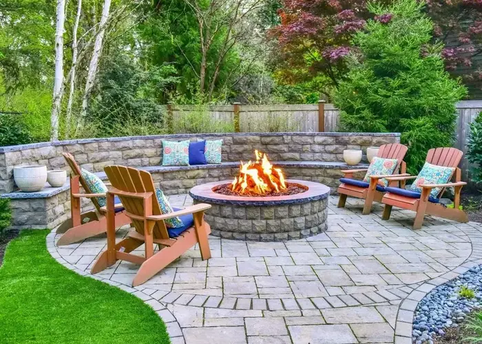 Brick and Gravel Fire Pit with Wooden Chairs