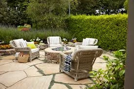 Simple Stone Patio with Wooden Chairs