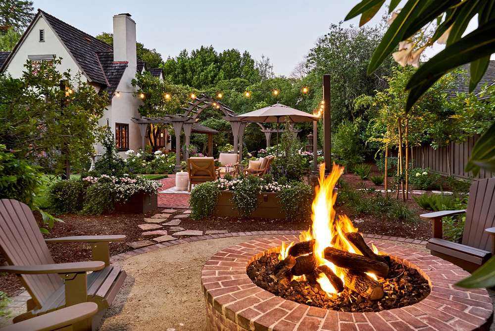 Red Brick Circular Fire Pit with Gravel Base and Stone Seating