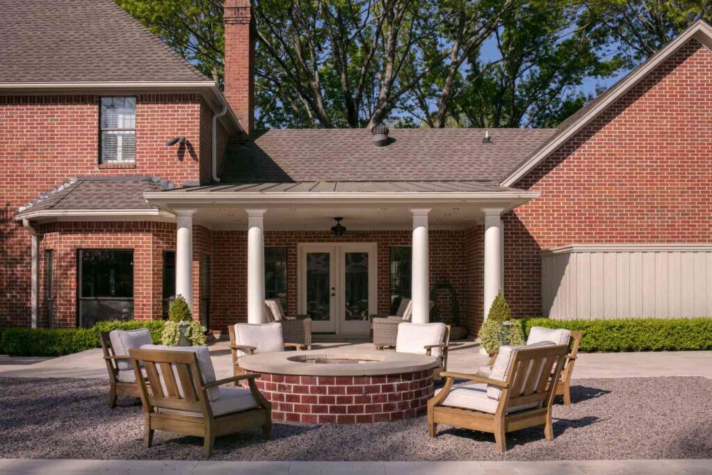 Rustic Red Brick Circular Fire Pit with Adirondack Chairs