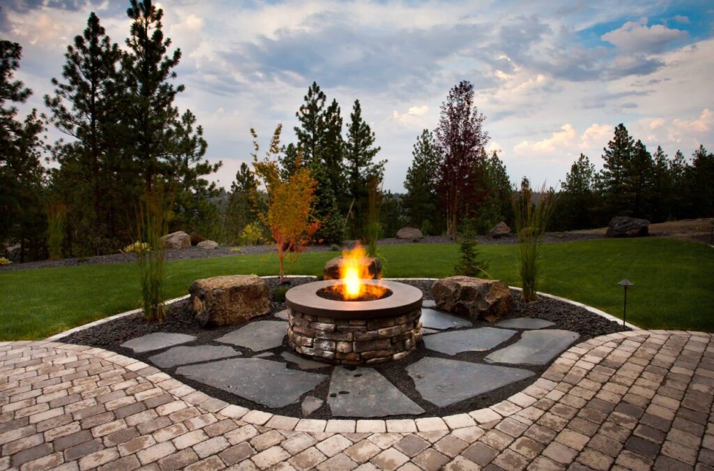 Oversized Red Brick Circular Fire Pit with Round Stone Seating