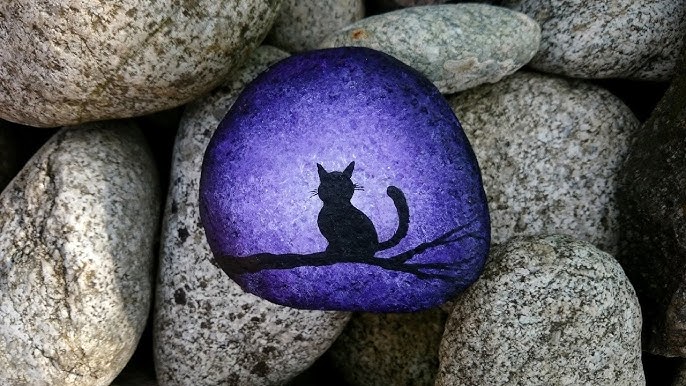 Simple Cat Silhouette on Black Rocks