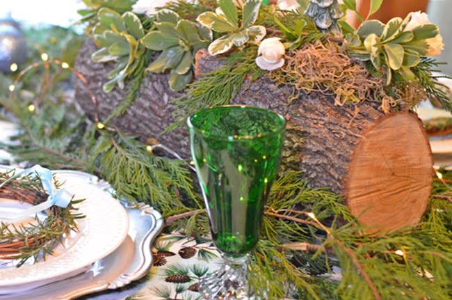 Use Yule Logs and Greenery for a Rustic Touch